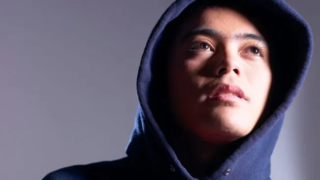 Teenager wearing hoody representing child vulnerable to county lines
