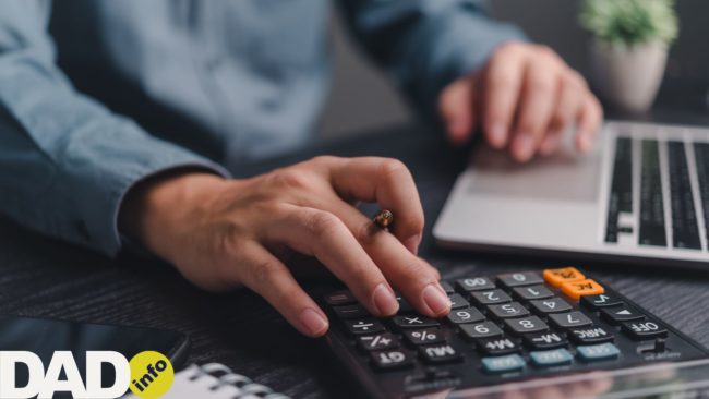 Man typing on a calculator