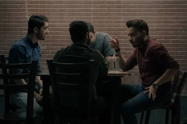 A group of men talking supporting one another