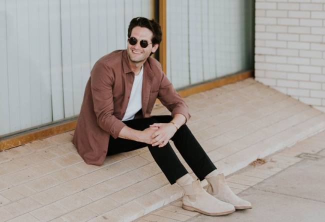 Man sitting down smiling