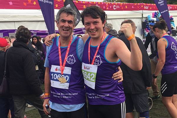 Lads and dads: Oliver and his father, Jim, celebrate completing the Royal Parks half marathon in October | Image: Julia Bellak