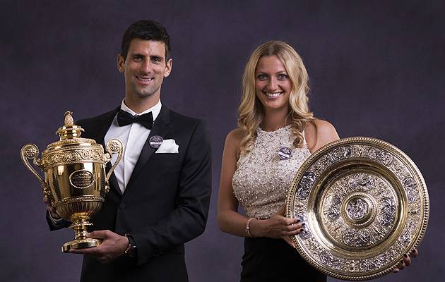 Having a ball: The 2014 winners, Novak Djokovic and Petra Kvitova, don their finest threads and show off their trophies | Image: All England Lawn Tennis and Croquet Club